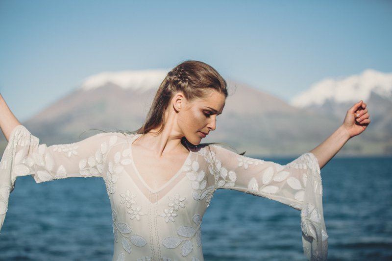 Wedding editorial with bride wearing Rue De Seine Zeppelin wedding gown at lake side wedding in Queenstown New Zealand