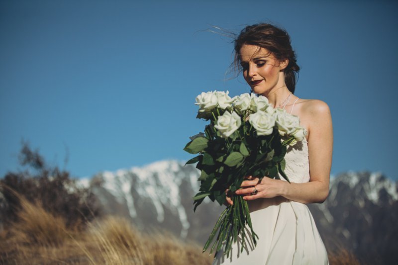 NZ High Country Queenstown wedding venue with Dawn Thomson Photography New Zealand wedding photographer featuring white long stem roses