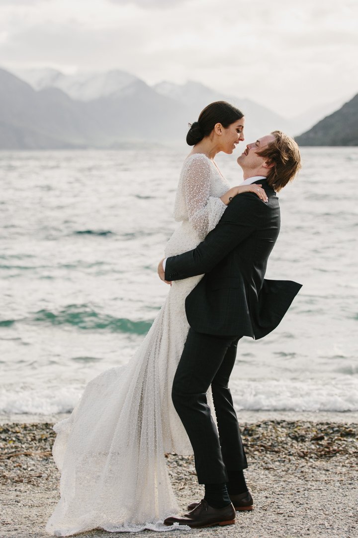 Eichardts Penthouse wedding Queenstown with bride and groom on lake front