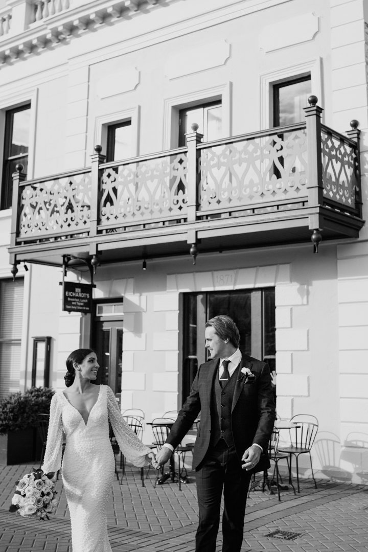 Bride and Groom at classic Eichardts Hotel penthouse wedding on the lakefront by Dawn Thomson Photography