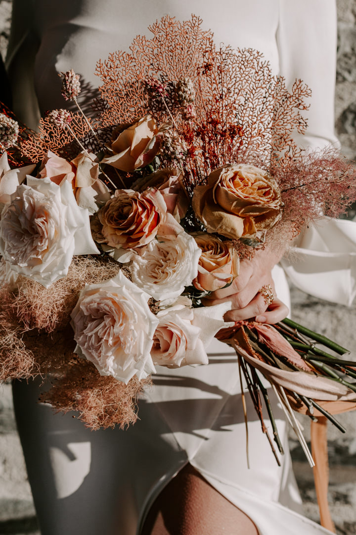 Coral in wedding bouquet with Feather and Stone Ribbons at Jacks Retreat Elopement Wedding in Queenstown, New Zealand by Dawn Thomson Photography