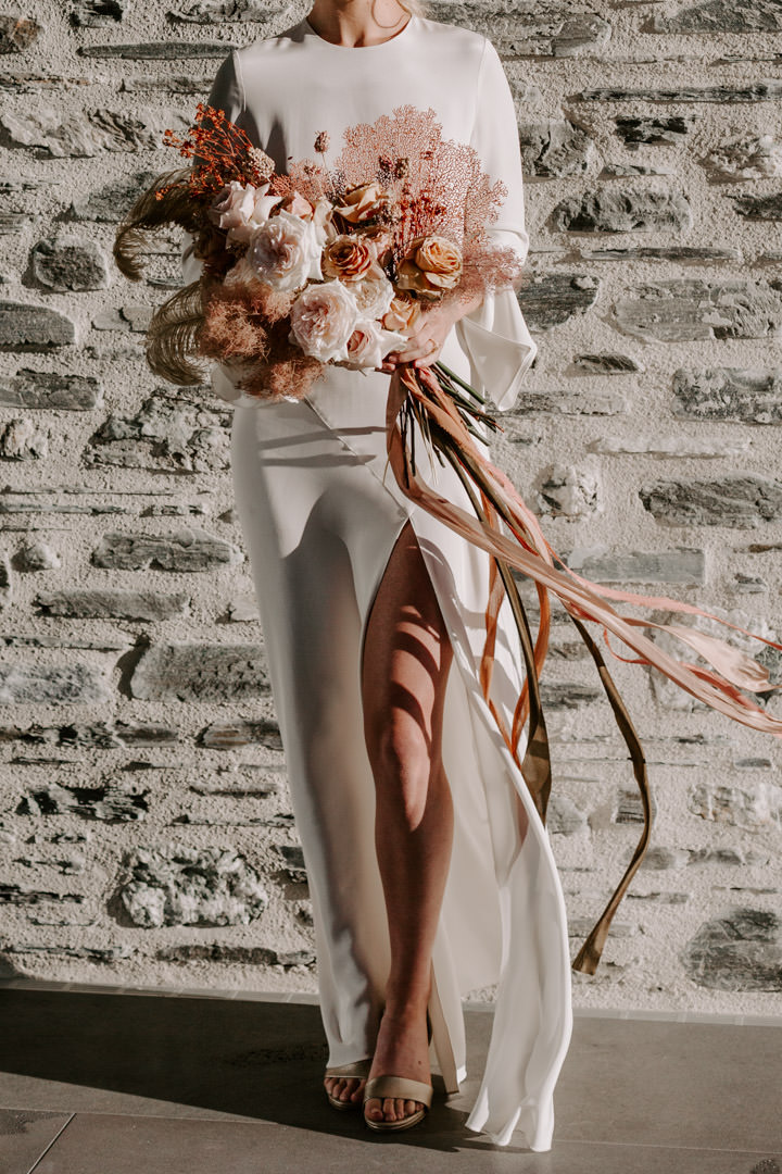 Coral in wedding flowers, Feather and Stone Ribbons at Jacks Retreat Elopement Wedding in Queenstown, New Zealand by Dawn Thomson Photography